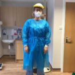 an image of a lady dressed in personal protective equipment (PPE)